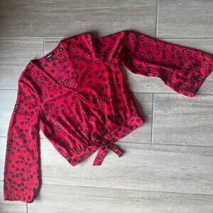 Express red flowy long sleeve top with black flower pattern - Size Medium